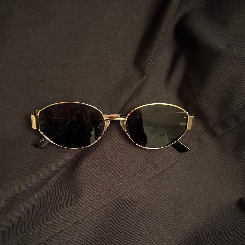 Elegant Gold and Black Oval Sunglasses